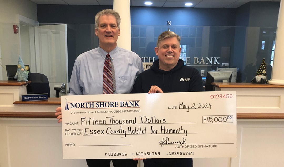 Photograph of North Shore Bank making a $15,000 contribution to the Essex County Habitat for Humanity