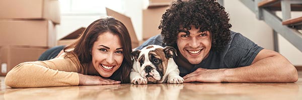 Young Couple with Dog on Floor - Online Homebuyer Certificate