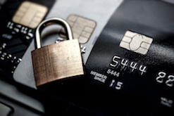 Image of a padlock on top of credit cards