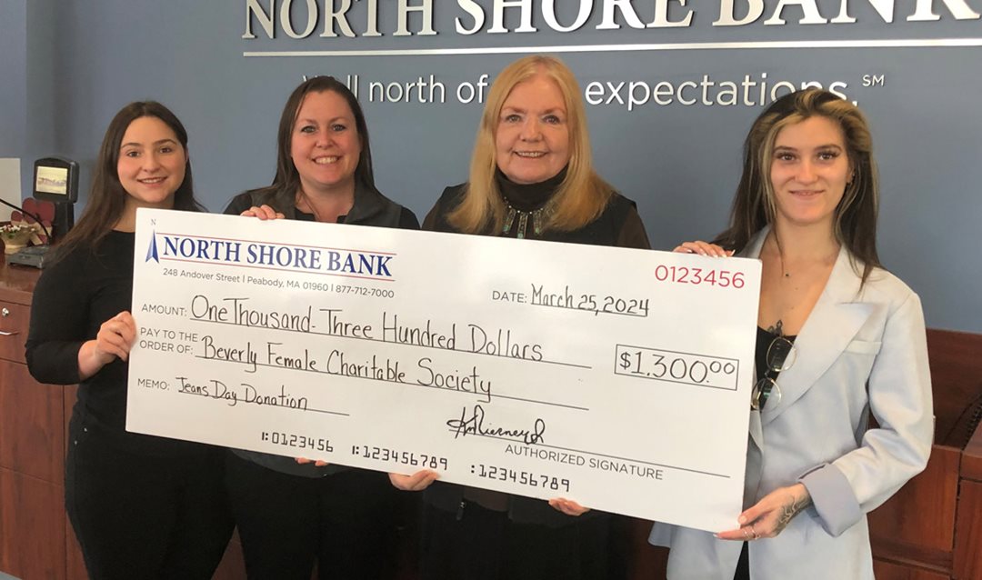 Photo of North Shore Bank presenting a $1,300 Jeans Day check to the Beverly Female Charitable Society