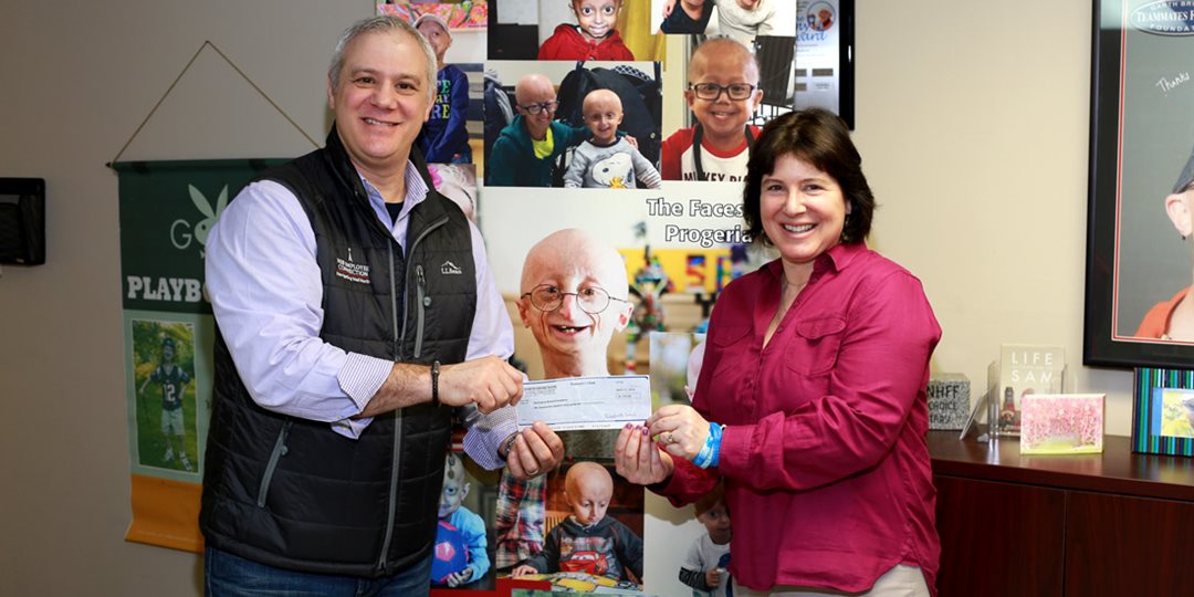 North Shore Bank presents $1,535 in Jeans Day dollars to The Progeria Research Foundation.