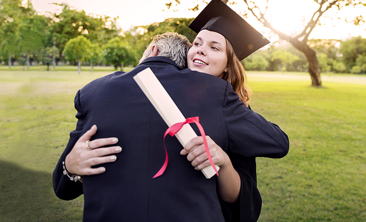 Image of female graduate hugging adult - home equity line of credit