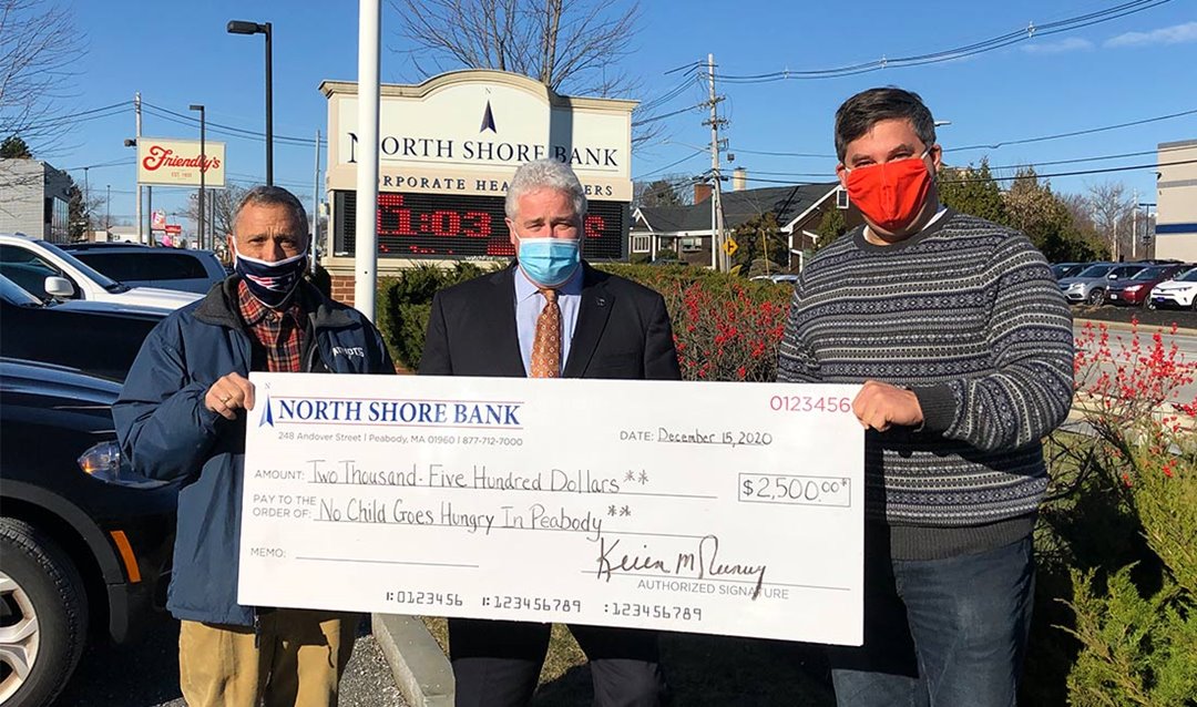 Photo of North Shore Bank presenting No Child Goes Hungry In Peabody with a $2,500 contribution.