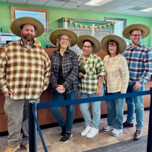 Abington Bank employees dressed up as farmers for Halloween.