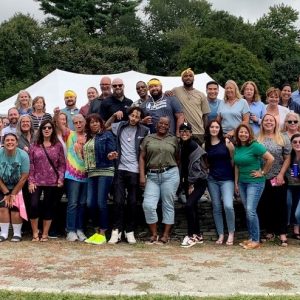 Employees gathered together outside for a celebration.